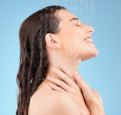 Buy stock photo Water splash, shower and woman cleaning on blue background for healthy skincare, cosmetics and wellness, beauty and happiness. Young studio model, water drops and body hygiene, bathroom and aesthetic