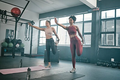 Buy stock photo Balance, stretching and friends with women in gym for training, workout and exercise. Teamwork, health and personal trainer with girl and muscle warm up for wellness, sports and fitness goals