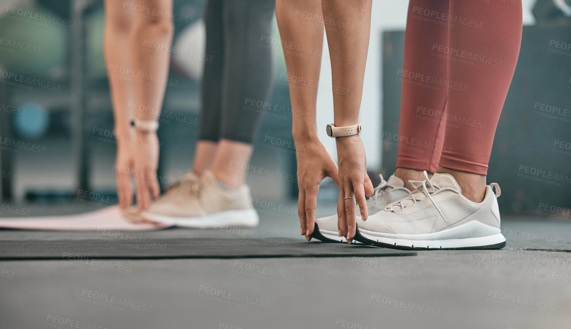 Buy stock photo Fitness, hands or women stretching legs at gym to warm up body or relax muscles for workout exercise. Girls, focus or healthy sports people training together for support, inspiration or motivation