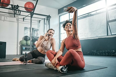 Buy stock photo Fitness, phone or friends take a selfie at gym for social media after workout exercises in health club. Relaxed girls, photo or happy sports women take pictures after exercising or training together