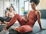 Fitness, phone or black woman on social media at gym relaxing on a break after workout exercises. Girl, overlay or healthy sports athlete resting or scrolling on social networking app after training