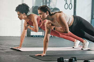 Buy stock photo Gym floor, health and exercise woman doing arm plank workout, performance training or core muscle building. Body self care, commitment and wellness for team, people or friends on fitness class ground