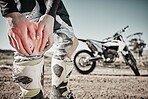 Knee pain, sports injury and hands with motorbike for race competition, training and adventure on road with red overlay. Travel, motorcycle and athlete person or man leg for medical emergency or risk