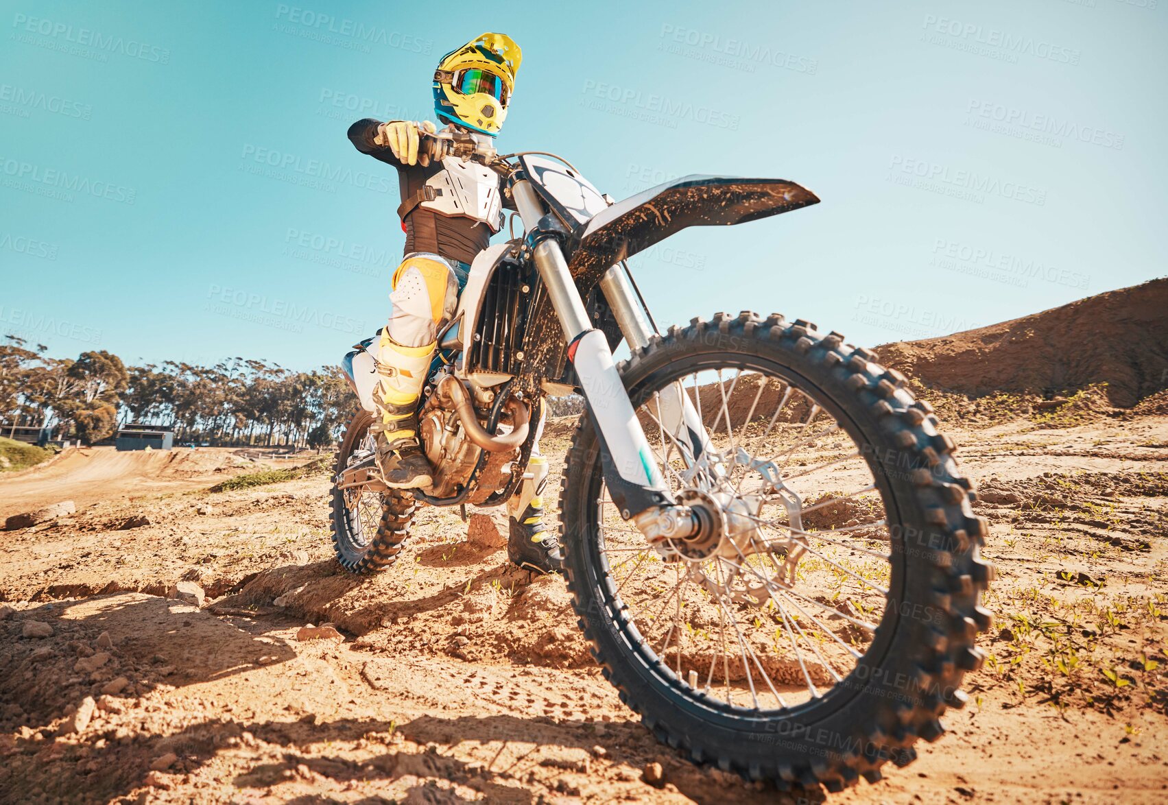 Buy stock photo Motorcross, motorcyclist and man in sports gear for challenge, offroad race and desert rally. Driver, bike and ready for dirt track competition, motorbike performance and action on adventure course 