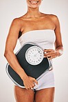 Woman, body and lose weight with scale for healthy diet, health and wellness. Model person on studio background for fitness, goals and motivation in underwear for exercise results and progress