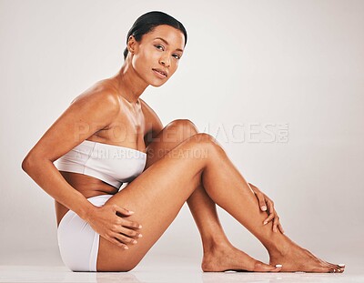 Buy stock photo Black woman, body and legs portrait for health and wellness in studio for skincare, epilation and self care. Underwear model person on grey background for healthy diet, hair removal and spa results