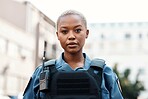 Portrait, police or black woman in city for law enforcement, security protection or legal street safety. Cop, walkie talkie or serious security guard on patrol in urban town for crime or justice