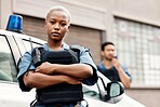 Black woman, police and arms crossed in city for law enforcement protection or street safety. Portrait of serious African female person, security guard or cop ready for justice or crime in urban town