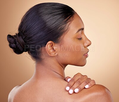 Buy stock photo Beauty, face and woman touch back with natural skincare shine, cosmetics treatment and morning self care routine. Spa salon, dermatology or Indian person with anti aging skin glow on brown background