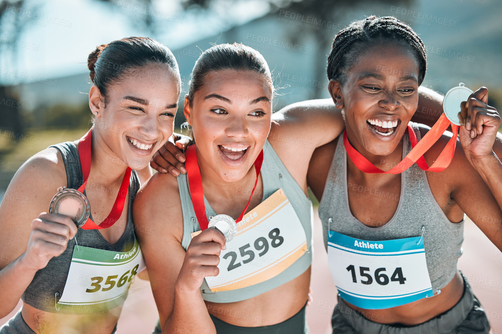 Buy stock photo Happy women, award and celebration in winning, running or competition together on stadium track. Group of athletic people smile in happiness, medal or victory in sports marathon or success