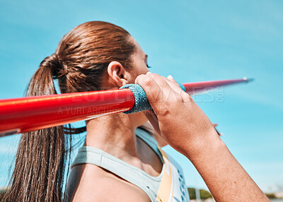 Woman, javelin and athlete in sports competition, practice or training in fitness on stadium field. Active female person or athletic competitor throwing spear, poll or stick in distance