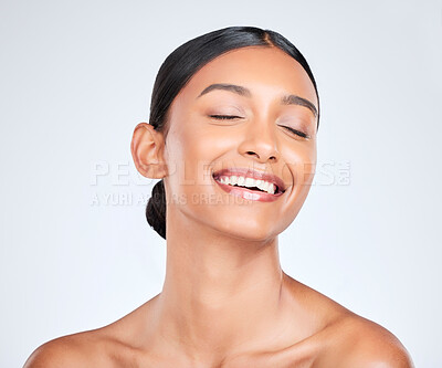 Buy stock photo Woman smile, face and beauty with skincare, dermatology and facial treatment in studio. Eyes closed, happy female model and wellness with skin cosmetics and glow from makeup with white background