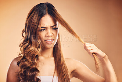 Buy stock photo Hair, problem and women with crisis and frustrated from salon treatment and Brazilian fail. Studio, brown background and angry model with damage from split ends and upset of bad and messy haircut 