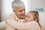 Love, couch, and child hug grandmother in a home for bonding, care and relax together for holiday or vacation. Senior, sofa and elderly person or grandparent with girl kid as family on retirement