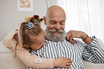 Love, couch, and child hug grandfather in a home for bonding, care and relax together for holiday or vacation. Senior, sofa and elderly person or grandparent with girl kid as family on retirement