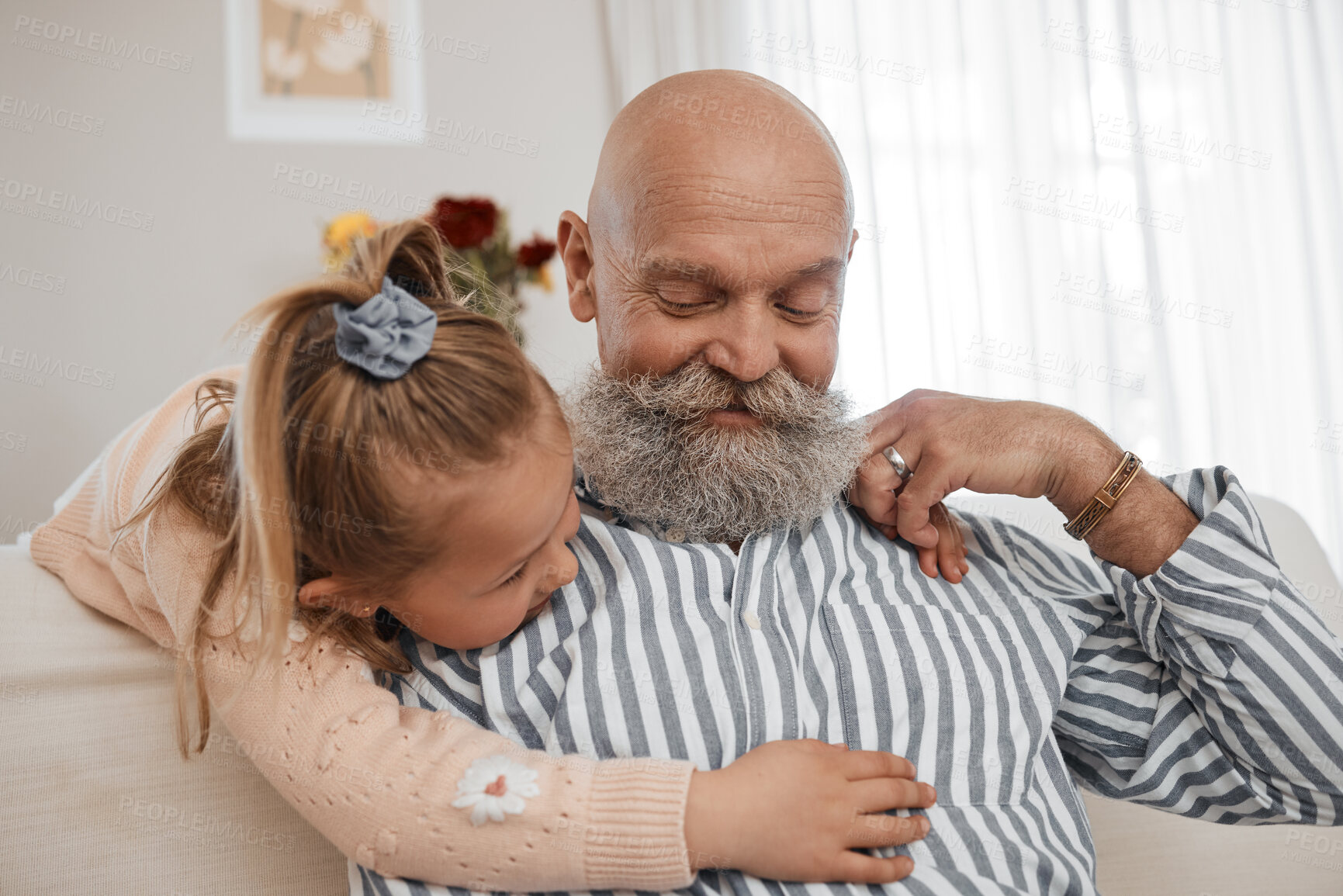 Buy stock photo Love, couch, and child hug grandfather in a home for bonding, care and relax together in living room for fun. Senior, sofa and elderly person or grandparent with girl kid as family on retirement