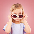 Curious, face and girl child with glasses in studio with news, announcement or promo on pink background. Interesting, information and kid hearing gossip, story or secret, rumor or watching drama