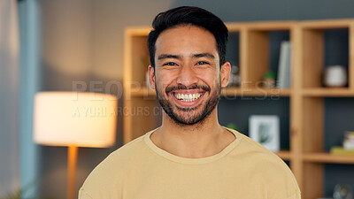 Buy stock photo Happy, portrait and asian man in a living room at night with confidence, good mood and chilling in his home. Face, smile and Japanese male person in a house in the evening relax, cheerful or positive