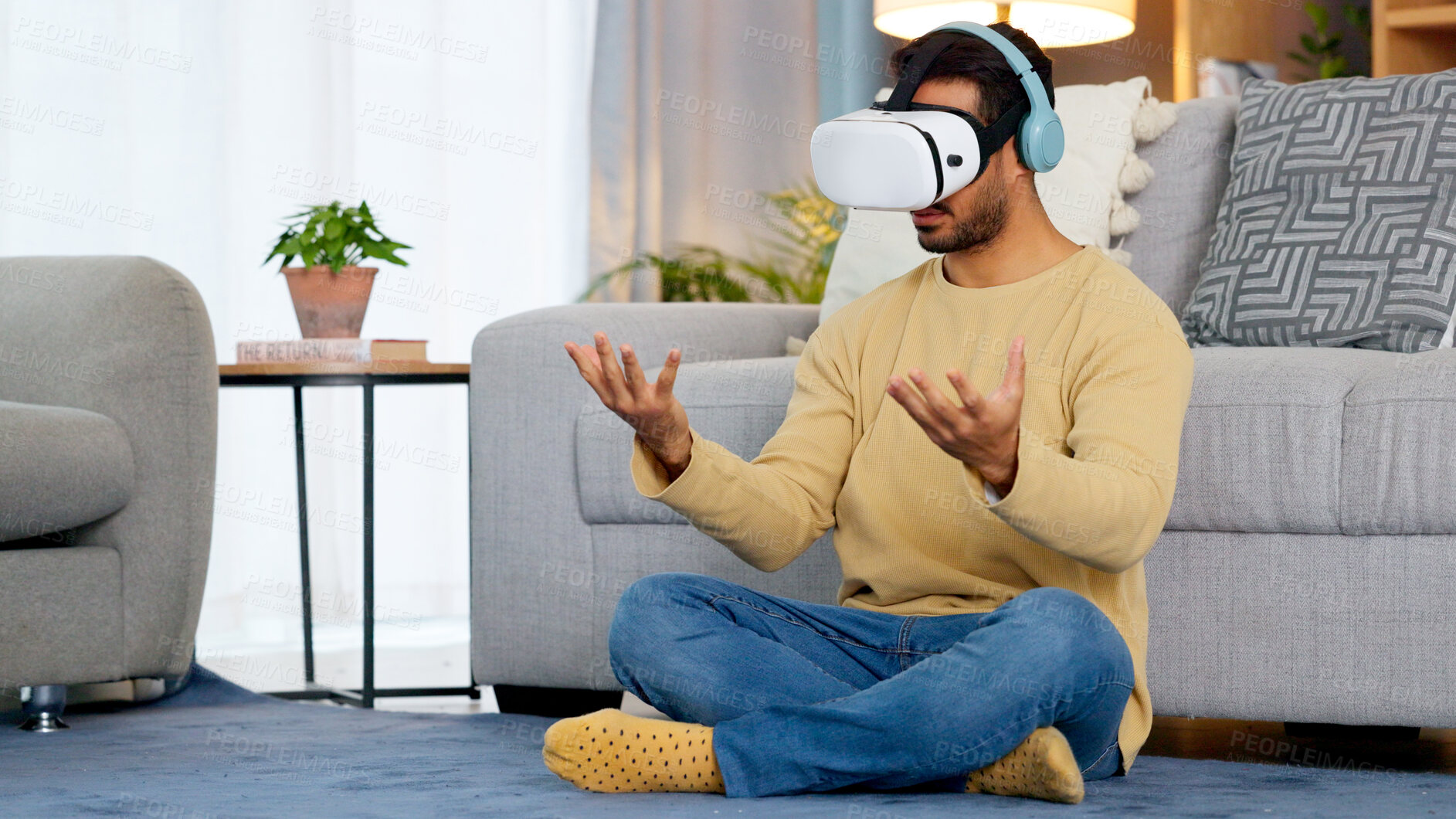 Buy stock photo Lounge, virtual reality glasses and man with connection, gaming and headphones with stress relief. Person, home or player with esports, online gaming or VR eyewear with metaverse, futuristic or relax