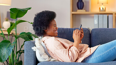 Buy stock photo Black woman, laughing and sofa with phone text and funny web meme at home. Happy, African female person relax and browsing social media on mobile app on the couch with website scroll in living room