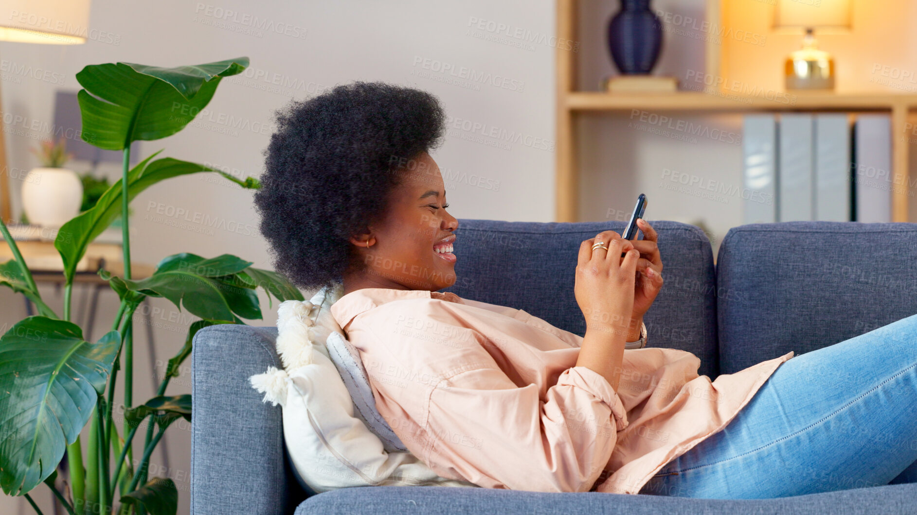 Buy stock photo Black woman, laughing and sofa with phone text and funny web meme at home. Happy, African female person relax and browsing social media on mobile app on the couch with website scroll in living room