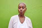 Happy, silly and young black woman by a green wall with trendy, classy and elegant jewelry and outfit. Happiness, goofy and African female model with positive and confident attitude with fashion.