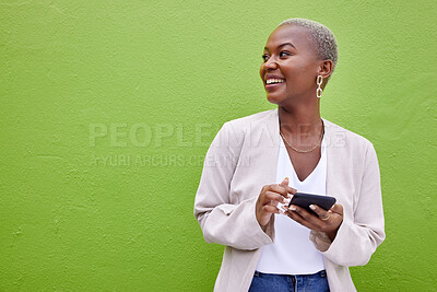 Buy stock photo Woman, thinking and phone for communication by a wall or green background with internet. Happy African female person outdoor with a smartphone for social media, networking app and chat mockup space