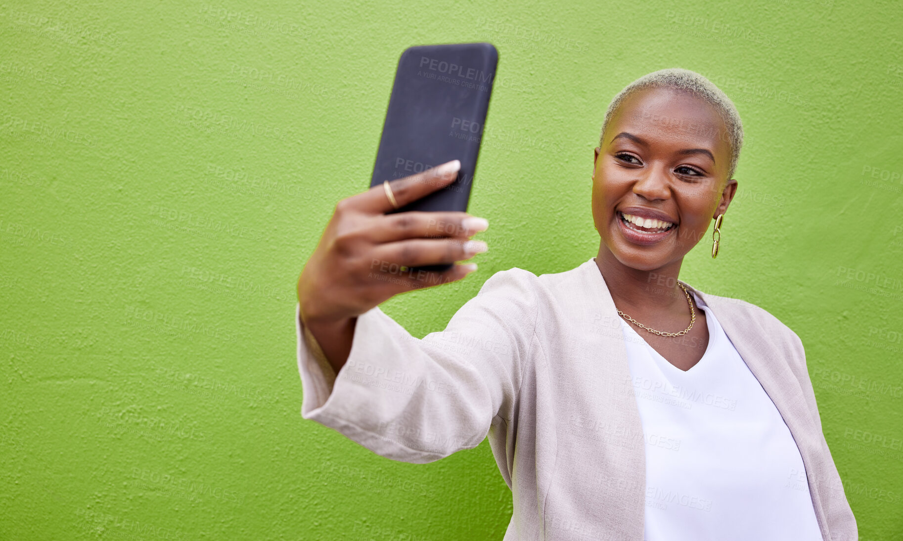 Buy stock photo Young African woman, selfie and wall with smile, excited face and photography for web blog by green background. Happy influencer, memory and profile picture with update, post and social network app