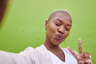 Buy stock photo Peace, selfie and young black woman by a green wall with trendy, classy and elegant jewelry and outfit. Happy, smile and African female model taking a picture with positive and confident attitude.