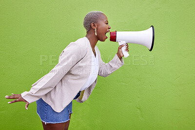 Buy stock photo Black woman, megaphone and protest on mockup space in advertising or voice against a studio background. African female person screaming in bullhorn or shouting for sale discount, vote or alert