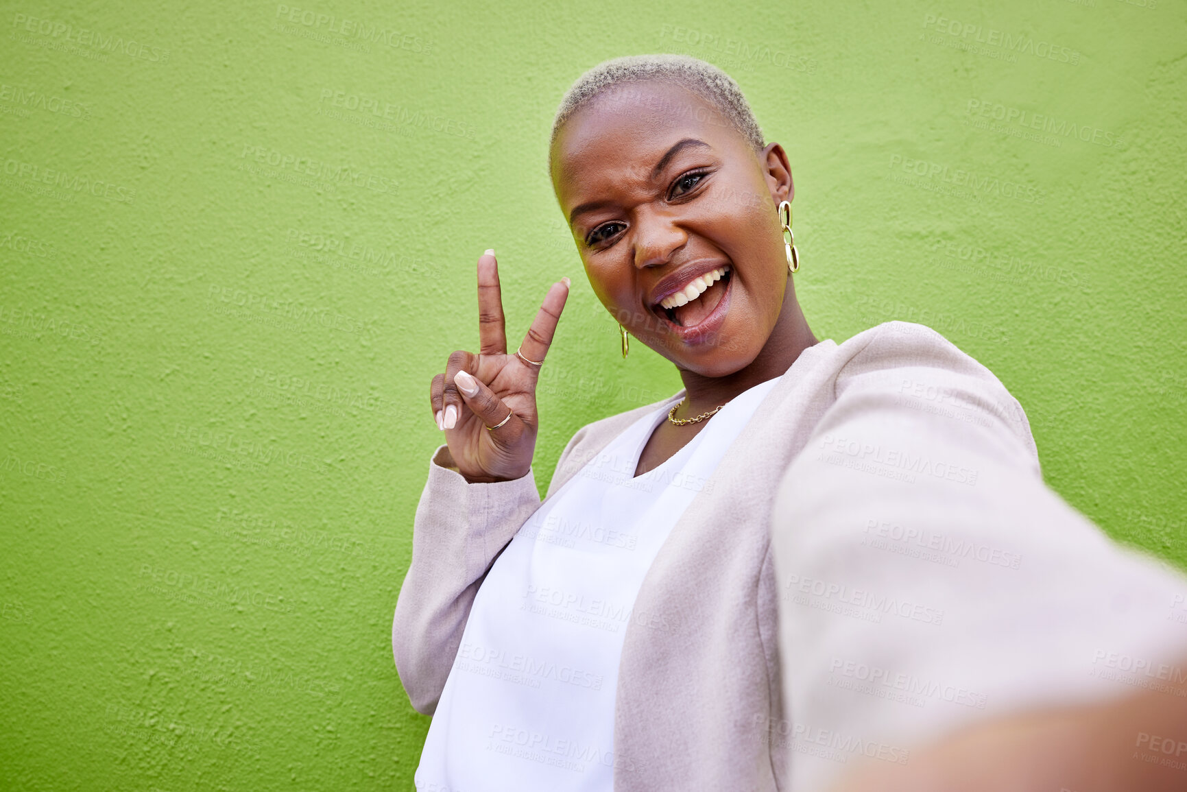 Buy stock photo Selfie, peace and portrait of black woman by green wall with trendy, classy and elegant jewelry and outfit. Happy, smile and African female model taking a picture with positive and confident attitude