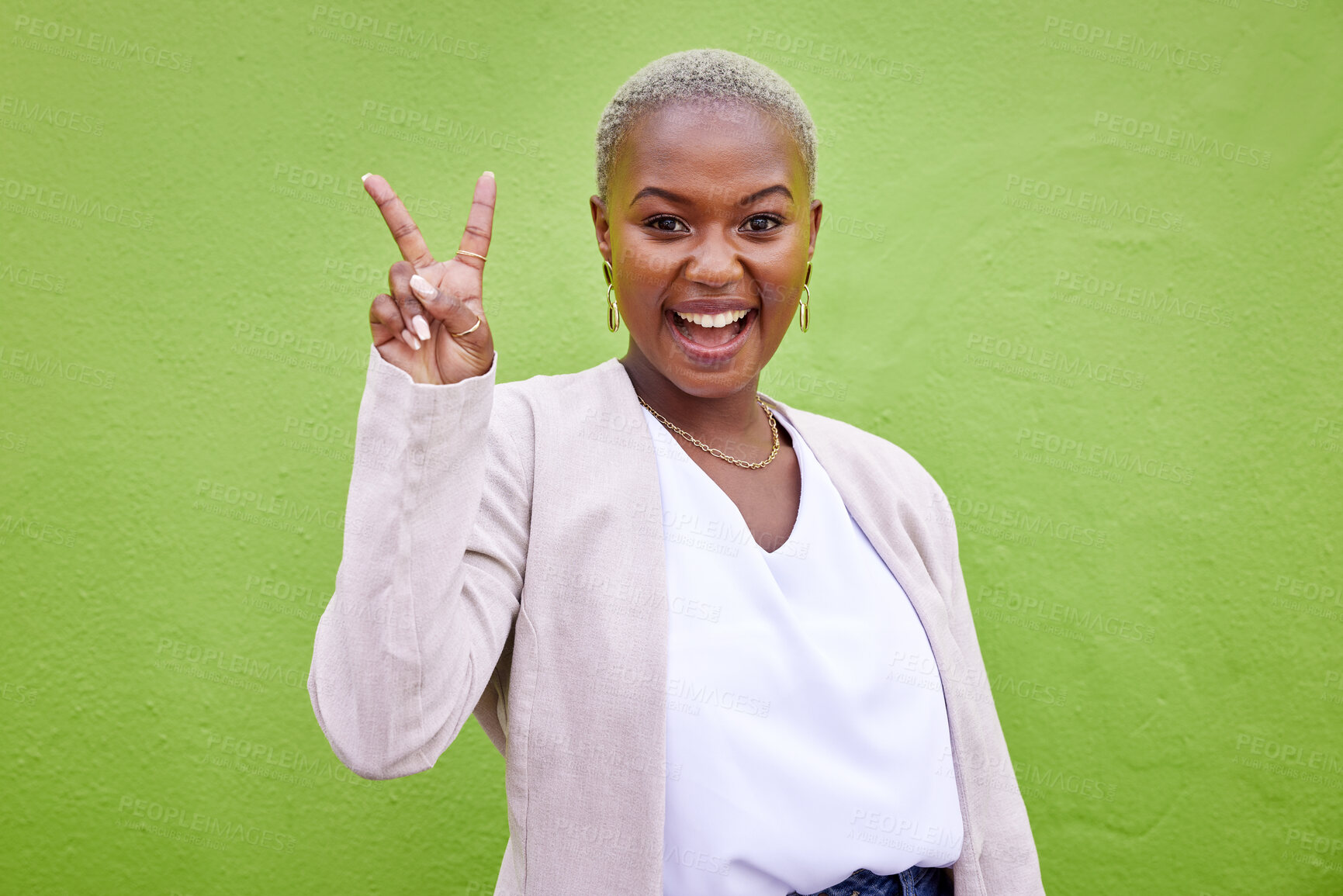 Buy stock photo Smile, peace sign and portrait of black woman by a green wall with classy and elegant jewelry and outfit. Happy, excited and African female model with positive and confident attitude with fashion.