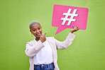 Portrait, pointing and black woman with a hashtag speech bubble for social media. Contact, African person or girl with a board for a blog sign, networking or virtual connection on a green background