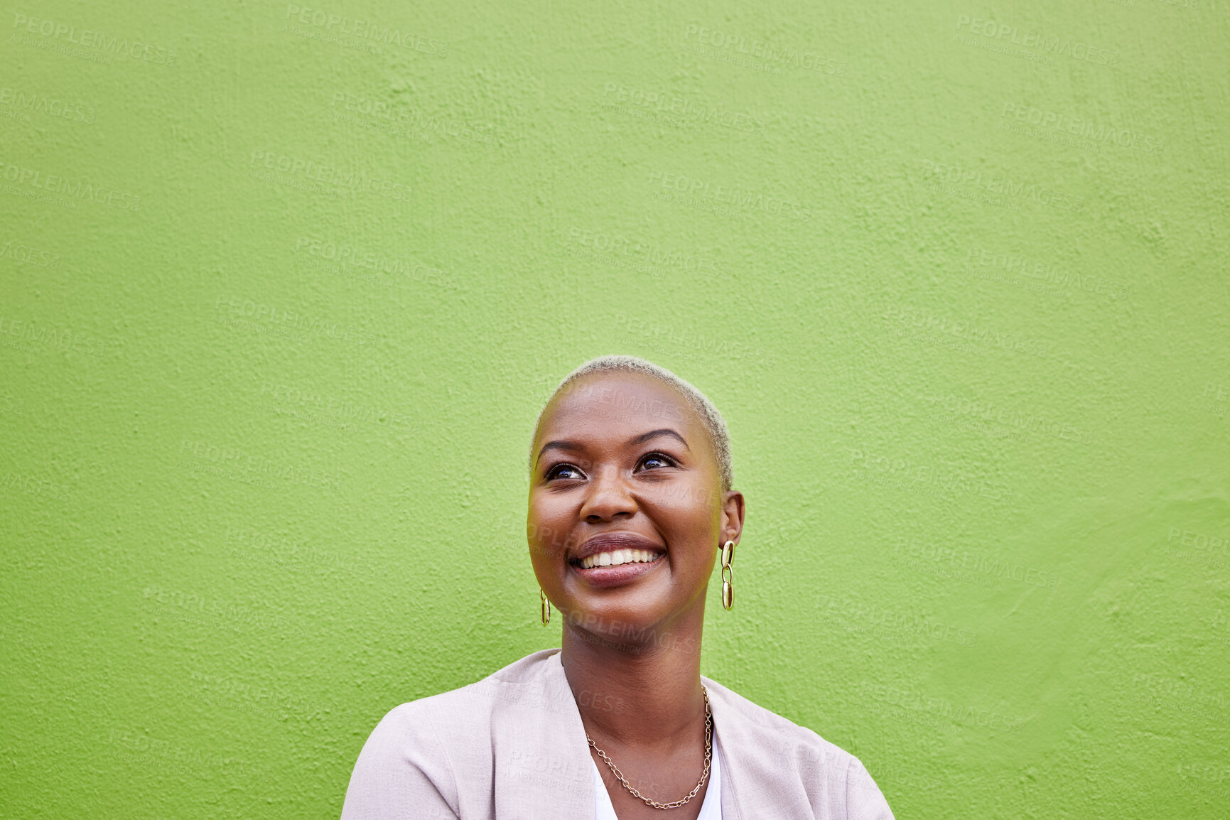 Buy stock photo Happy, thinking and black woman by green wall with mockup space for marketing, promotion or advertising. Idea, smile and young African female model with dreaming, memory or reflection face expression