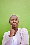 Thinking, memory and young black woman by a green wall with classy and elegant jewelry and outfit. Idea, question and African female model with positive and confident attitude with mockup space.