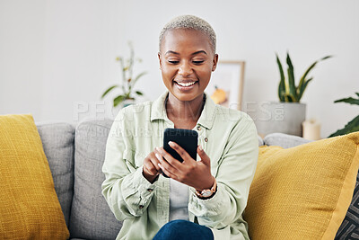 Buy stock photo Phone, home or happy woman online to chat for communication, texting or social media. Reading news, smile or African person typing on mobile app to scroll on dating website or digital network on sofa