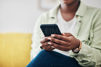 Buy stock photo Hands of woman on sofa with phone, typing on social media and scroll on post or video online. Technology, internet and girl on couch with smartphone, digital app and like for viral content at home.