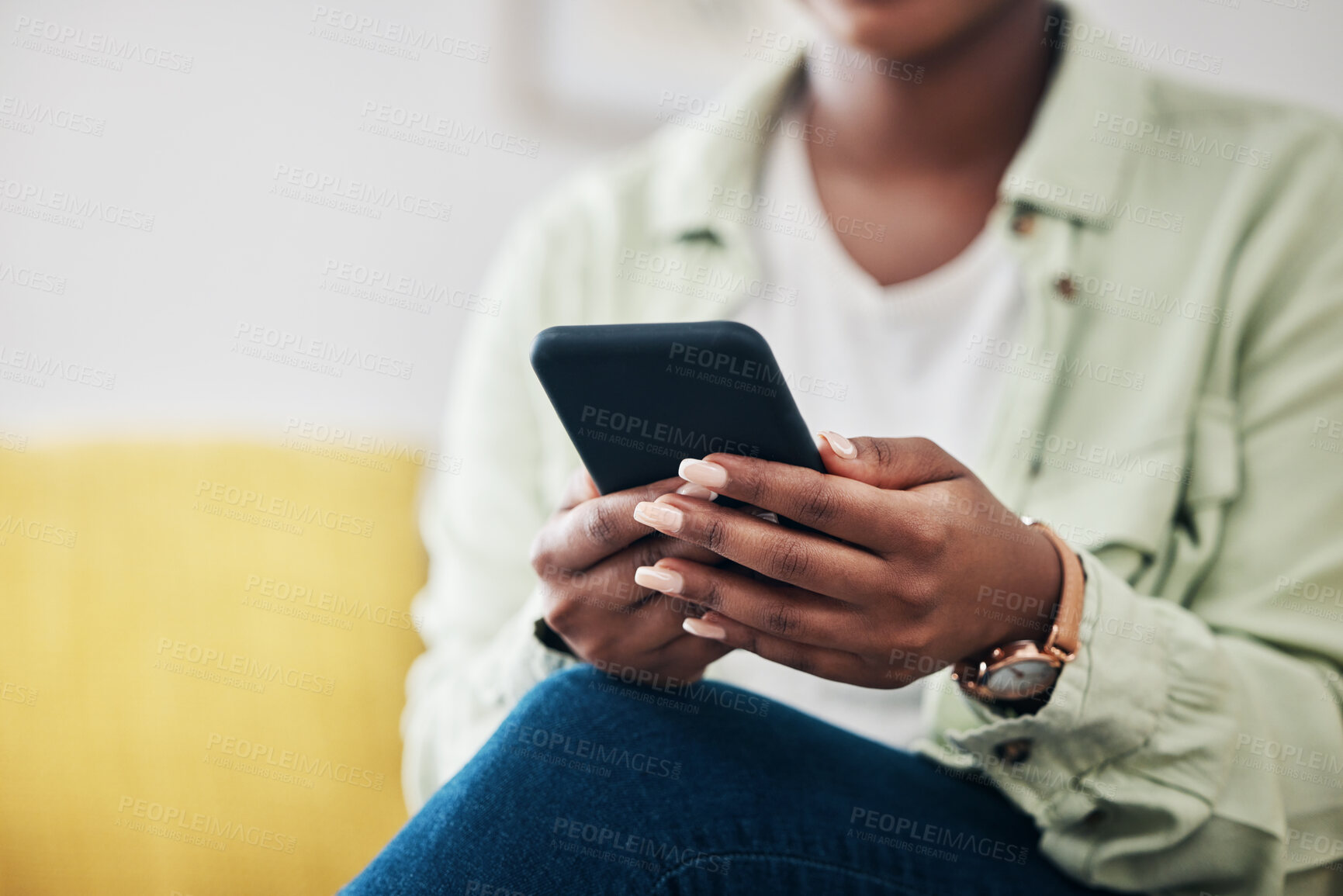 Buy stock photo Hands of woman on sofa with phone, typing on social media and scroll on post or video online. Technology, internet and girl on couch with smartphone, digital app and like for viral content at home.