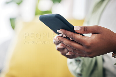 Buy stock photo Hands of woman on sofa with phone, typing and checking social media, message or video online. Technology, internet and girl on couch with smartphone, digital app and like for viral content at home.