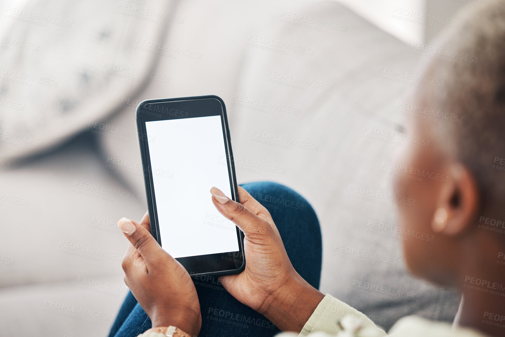 Buy stock photo Hands of woman on sofa with phone screen, scroll and social media, message or video online. Technology, internet and girl on couch with smartphone, digital app and mockup for website or platform.