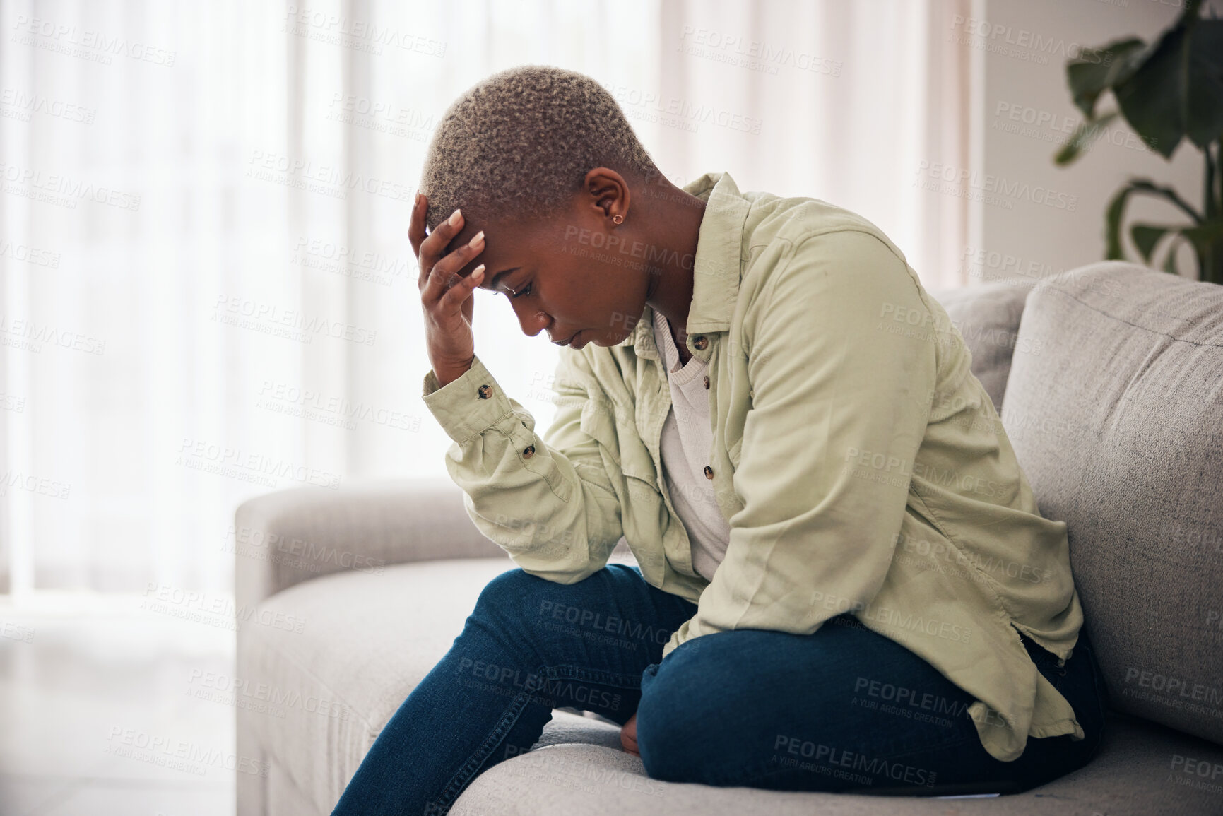 Buy stock photo Woman, headache and depression on sofa for sad memory, mental health and frustrated anxiety at home. Stress, worry and lonely african person in trauma of ptsd, broken heart and bad crisis for mistake