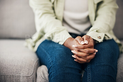 Buy stock photo Anxiety, hands and woman on a sofa with stress, fear or worry for mental health or domestic abuse in her home. Psychology, zoom and female with depression, bipolar or scared of gender based violence