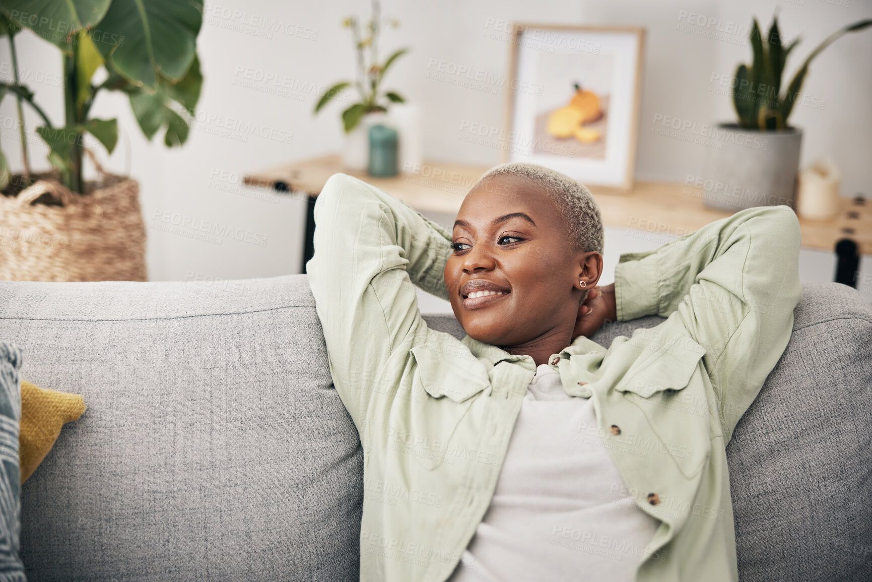 Buy stock photo Black woman, relax and calm stretching on sofa in home, living room and lounge with peace, happiness and rest on weekend. Happy, face and mindset of freedom in new house or apartment with homeowner