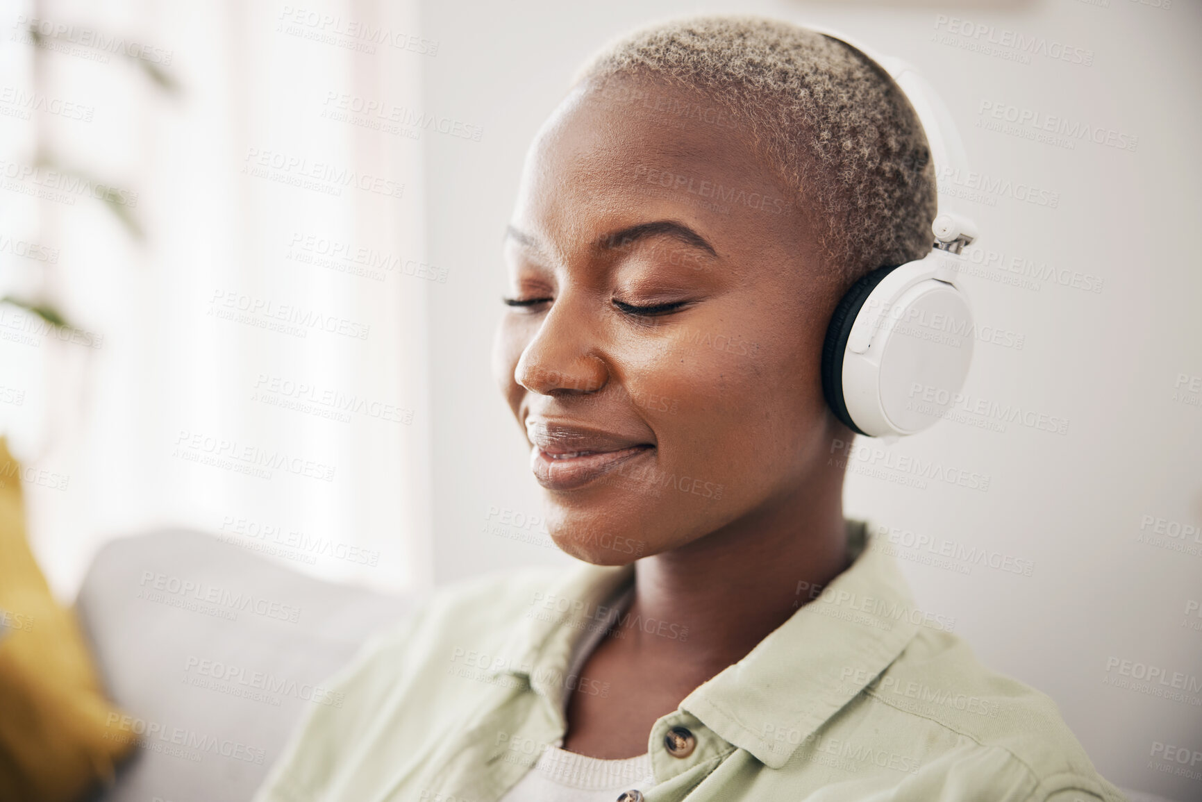 Buy stock photo Black woman, listening and meditation podcast on headphones in home, living room or peace on sofa in lounge. Music, tech and happiness on face of person with zen, mindset and wellness in apartment