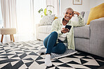 Happy woman, portrait and smartphone typing on floor in lounge for social media post, search contact or download mobile games. African person, cellphone user and subscription on digital app at home