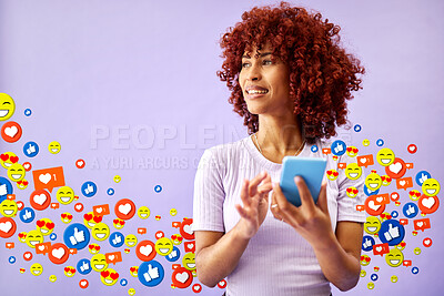 Buy stock photo Phone, social media and emoji notification with a black woman in studio on a purple background for communication. Mobile, app and reaction with a happy young person using technology to like a post