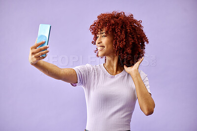 Smile, selfie and curly hair of woman in studio isolated on a purple background mockup space. Happy, photography and profile picture of person for fashion, style and social media post on internet
