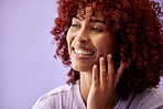 Makeup, hair and beauty transformation for woman in studio with hands on face for cosmetic results on purple background. Makeover, smile and female model with red afro, dye or texture satisfaction