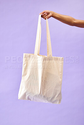 Buy stock photo Sustainability, shopping and eco friendly bag by person or recycling customer isolated in a studio purple background. Environment, retail and woman with carbon footprint, zero waste and grocery