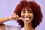 Face, smile and woman brushing teeth with wood in studio isolated on purple background. Portrait, bamboo toothbrush and happy person cleaning for eco friendly hygiene, dental health or sustainability